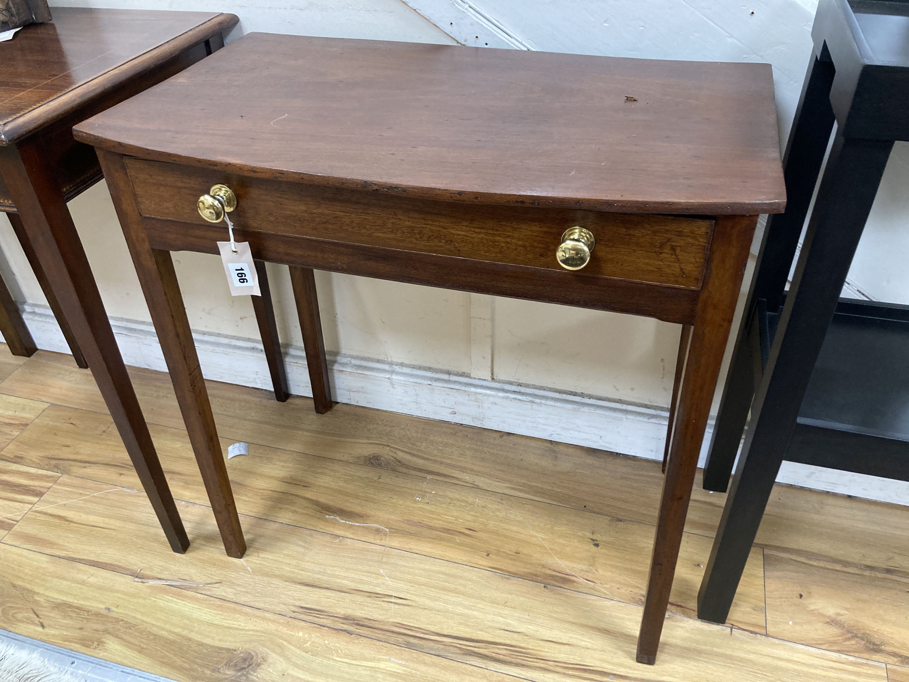 A George III mahogany bow front side table. W-72, D-43, H-71cm.